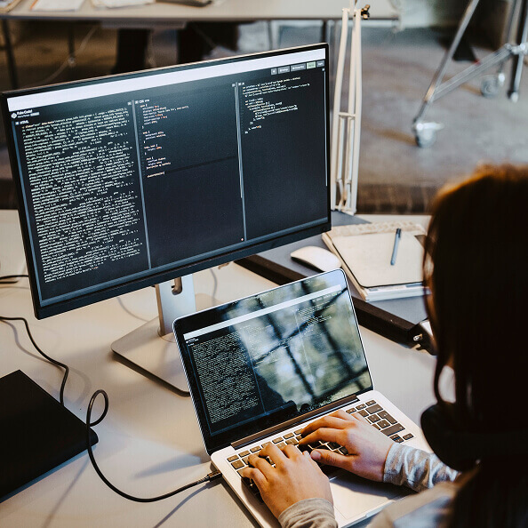 AI developer working on a computer